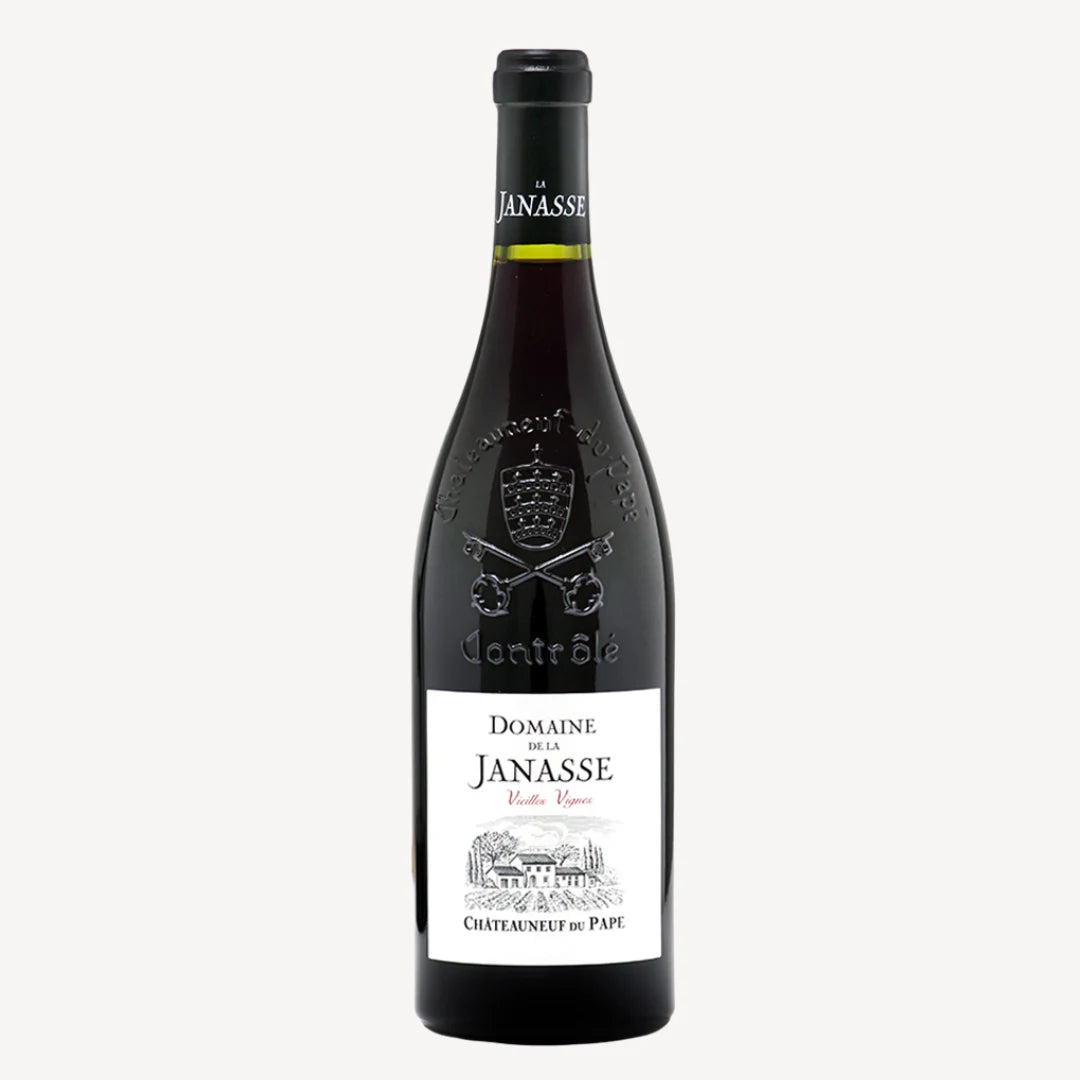 A bottle of Domaine de la Janasse Châteauneuf-du-Pape Vieilles Vignes 2020 red wine. The label is white with black and red text, featuring the producer's name, the appellation, and the vintage.