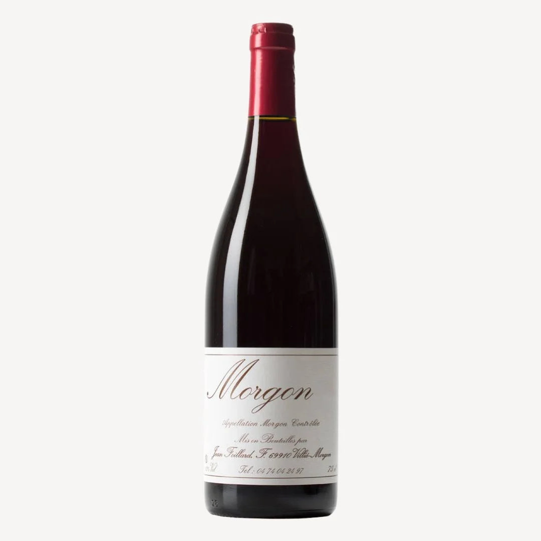 Bottle of red wine with a white label reading “Morgon” produced and bottled by Jean Foillard in Villié‑Morgon, France.