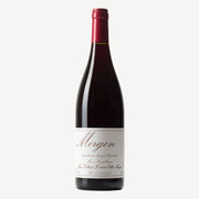 Bottle of red wine with a white label reading “Morgon” produced and bottled by Jean Foillard in Villié‑Morgon, France.