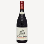A bottle of Le Vieux Donjon Châteauneuf-du-Pape 2020 red wine. The main label is white and features a black and white drawing of a stone castle or fortress, with the producer's name, "Le Vieux Donjon," in black, and "CHATEAUNEUF DU PAPE" in red. The bottle is dark glass with a dark red foil cap.